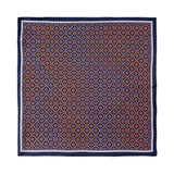 PAÑUELO DE SEDA CON GEOMETRÍAS DE CUADROS Y CÍRCULOS EN AZUL Y NARANJA