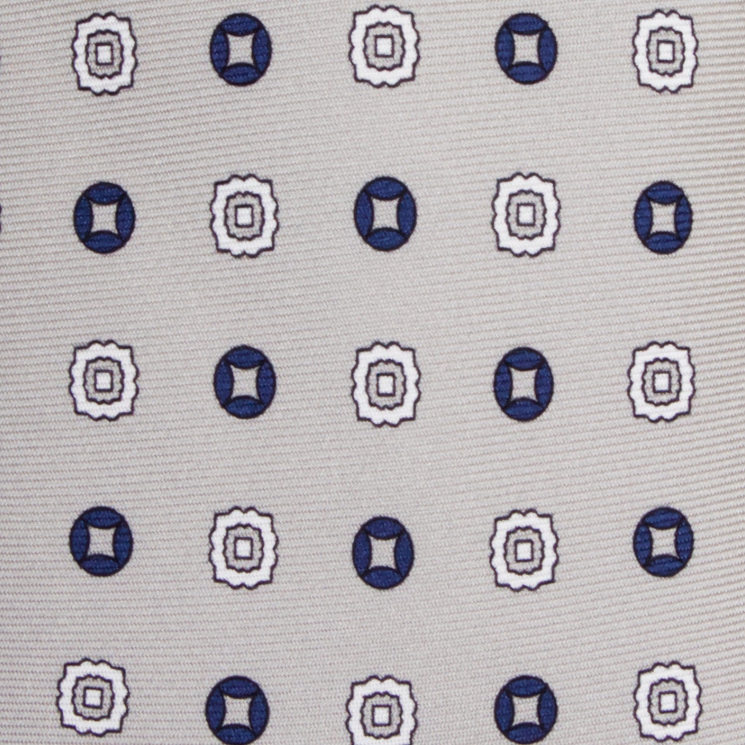 CORBATA 7 PLIEGUES EN SEDA CON FLORES AZULES Y GRIS OBSCURO EN GRIS CLARO