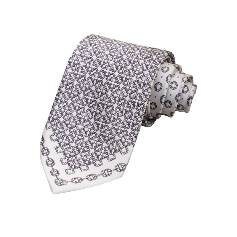 CORBATA EN SET CON PAÑUELO DE SEDA CON DIBUJOS GEOMÉTRICOS DEGRADADOS GRISES