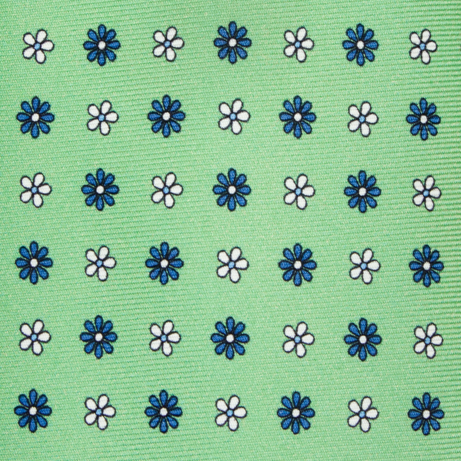 CORBATA 7 PLIEGUES EN SEDA WOOVEN CON FLORES EN BLANCO Y AZUL EN VERDE