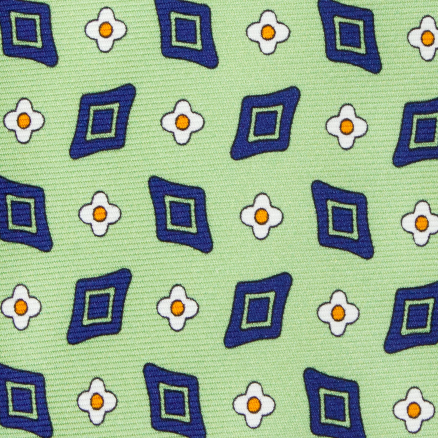 CORBATA 7 PLIEGUES EN SEDA CON FLORES BLANCAS Y ROMBOS VERDES EN VERDE CLARO