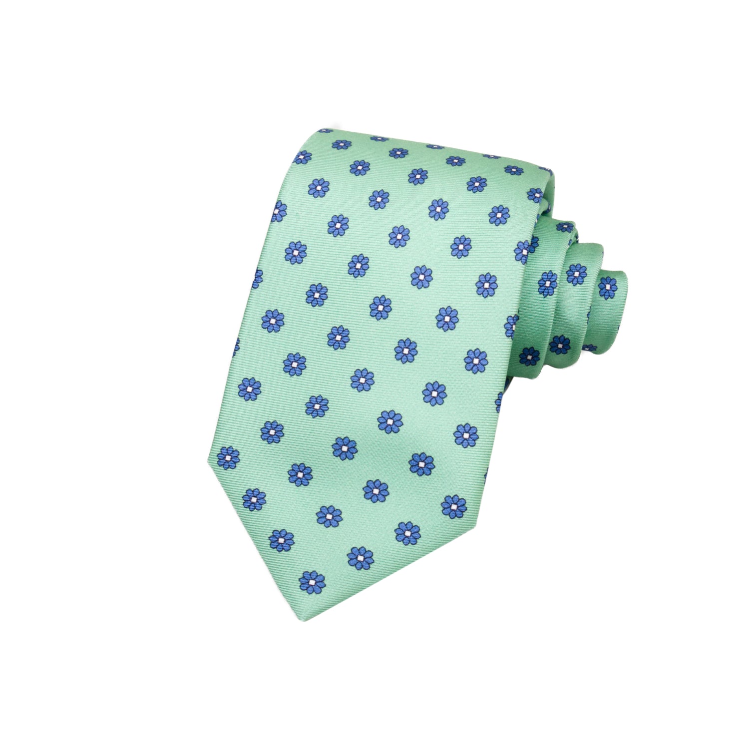 CORBATA 7 PLIEGUES EN SEDA CON FLORES AZULES CON PUNTOS BLANCOS EN VERDE