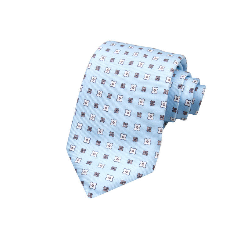 CORBATA 7 PLIEGUES EN SEDA CON FLORES BLANCAS Y MARRONES EN AZUL CIELO