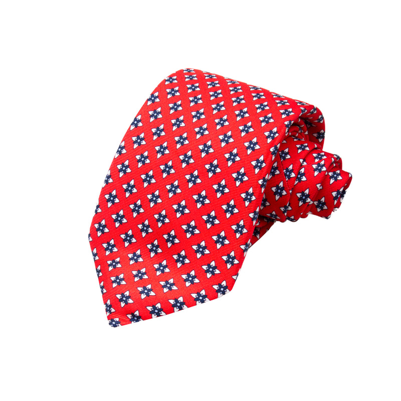 CORBATA 7 PLIEGUES EN SEDA CON FLORES BLANCAS Y AZULES EN ROJO
