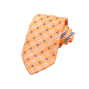 CORBATA DOBLE VISTA EN EN SEDA Y LINO CON ROMBOS GRISES Y FLORES BLANCAS EN COLOR NARANJA