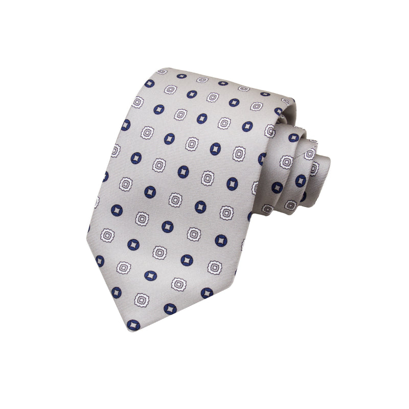 CORBATA 7 PLIEGUES EN SEDA CON FLORES AZULES Y GRIS OBSCURO EN GRIS CLARO