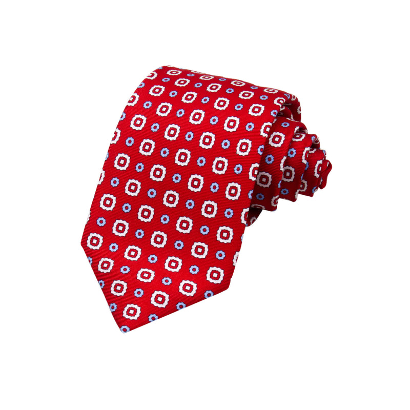 CORBATA 7 PLIEGUES EN SEDA CON FLORES BLANCAS, ROJAS Y AZULES EN ROJO