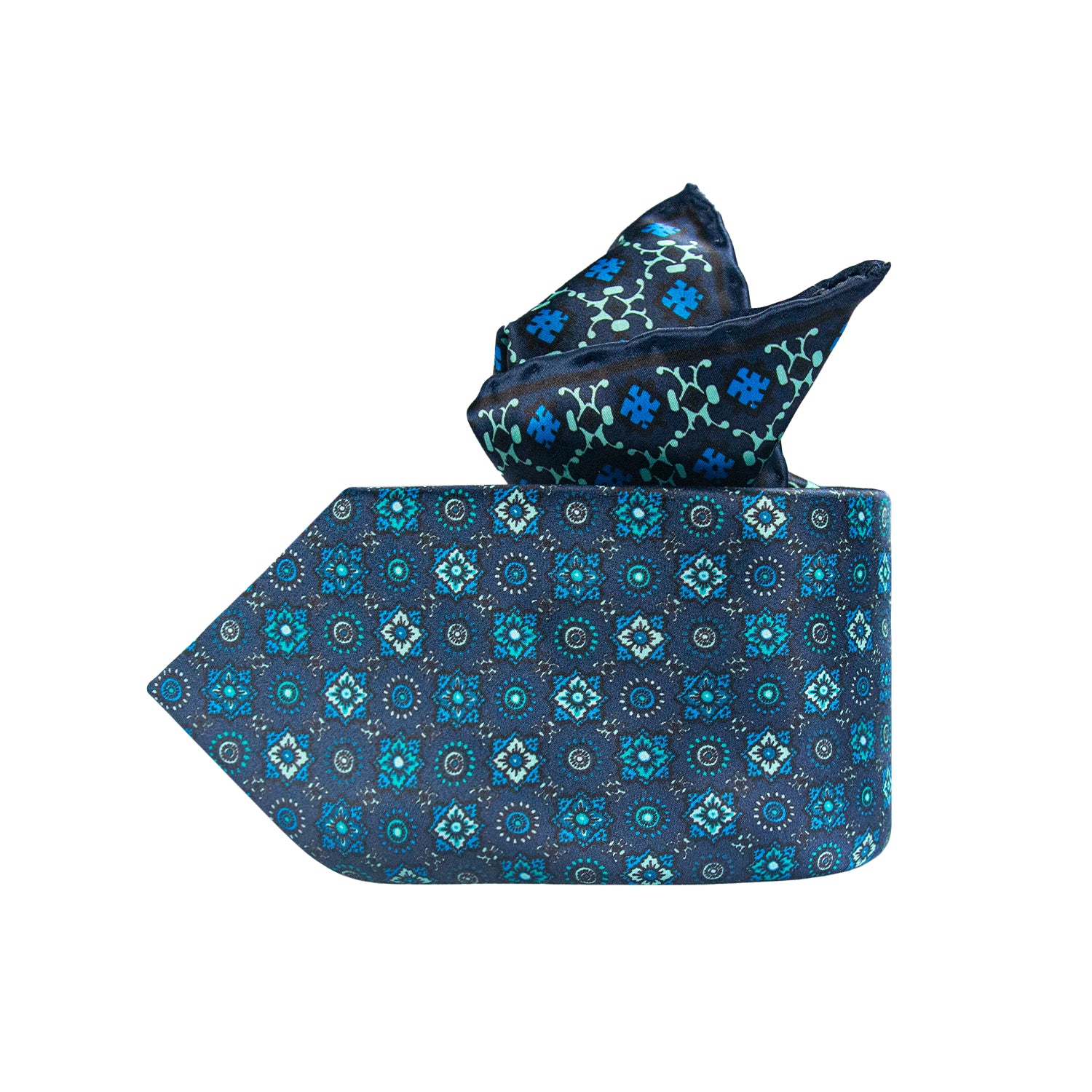 CORBATA EN SET CON PAÑUELO SOLITO FONDO AZUL MARINO CON FLORES TURQUESA CON CAJA 100% SEDA