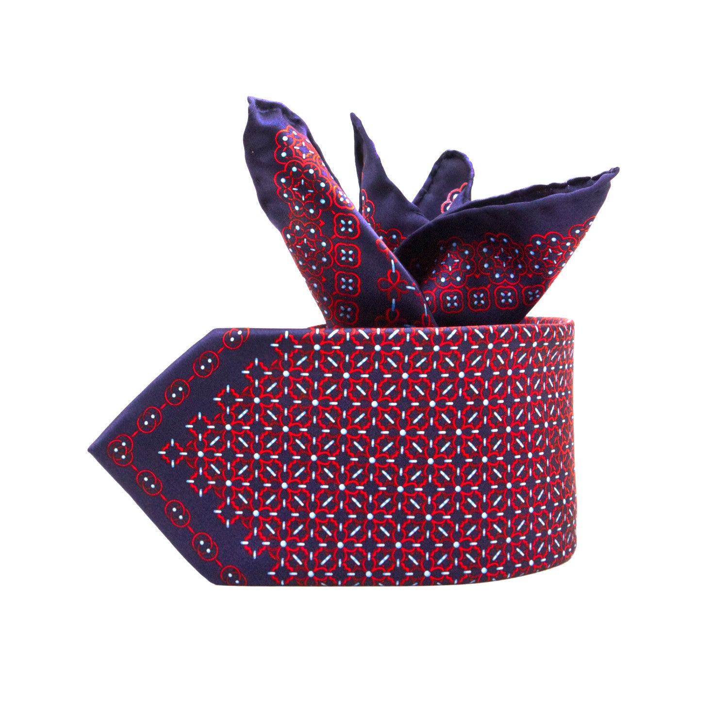 CORBATA EN SET CON PAÑUELO DE SEDA CON DIBUJOS GEOMÉTRICOS DE AZUL MARINO Y ROJO