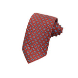 CORBATA 7 PLIEGUES EN SEDA GUINDA CON CUATRIFOLIOS AZUL MEDIO Y AZUL MARINO